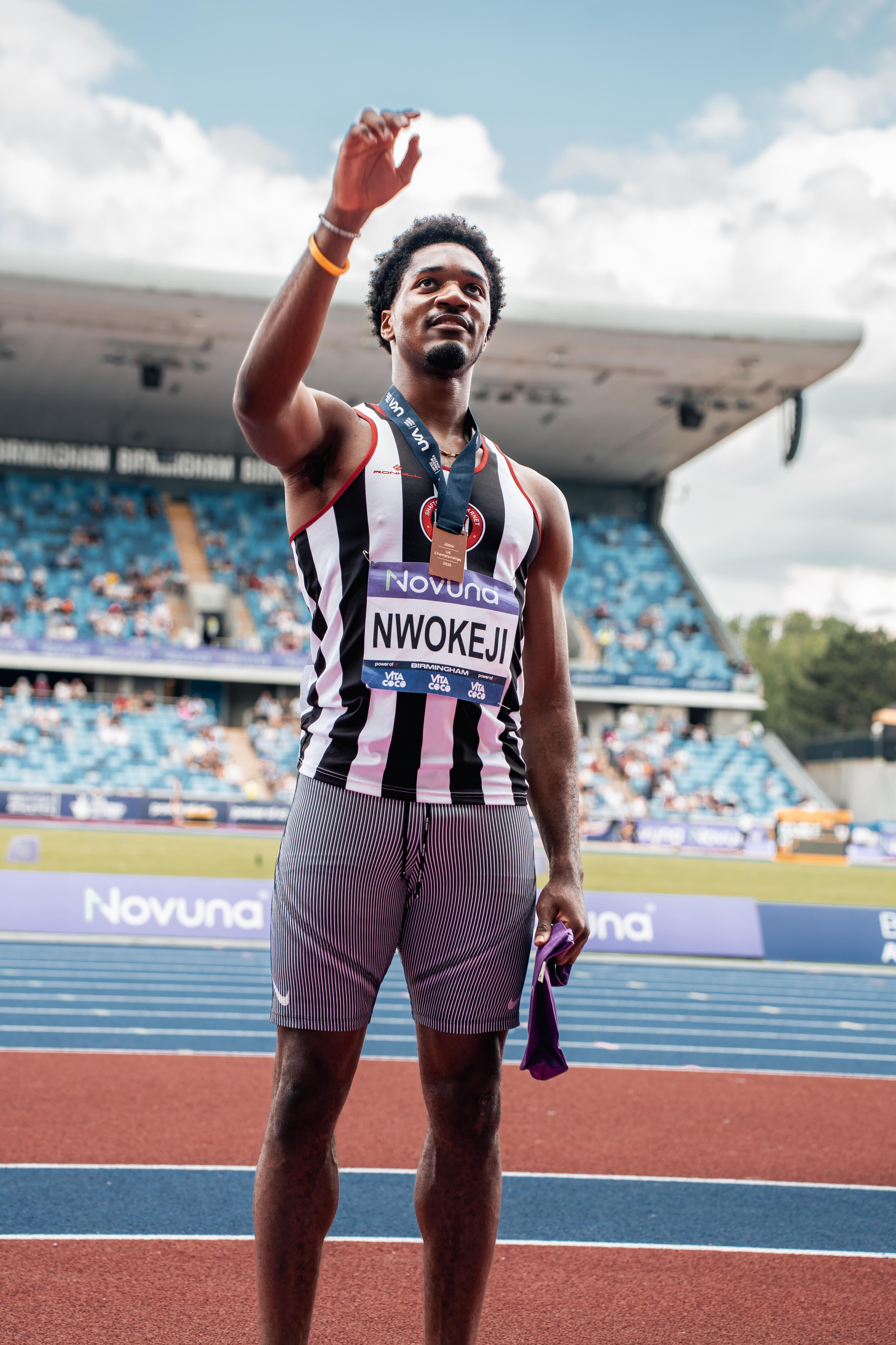 Ebuka Nwokeji on the podium at the British Championships, medal raised